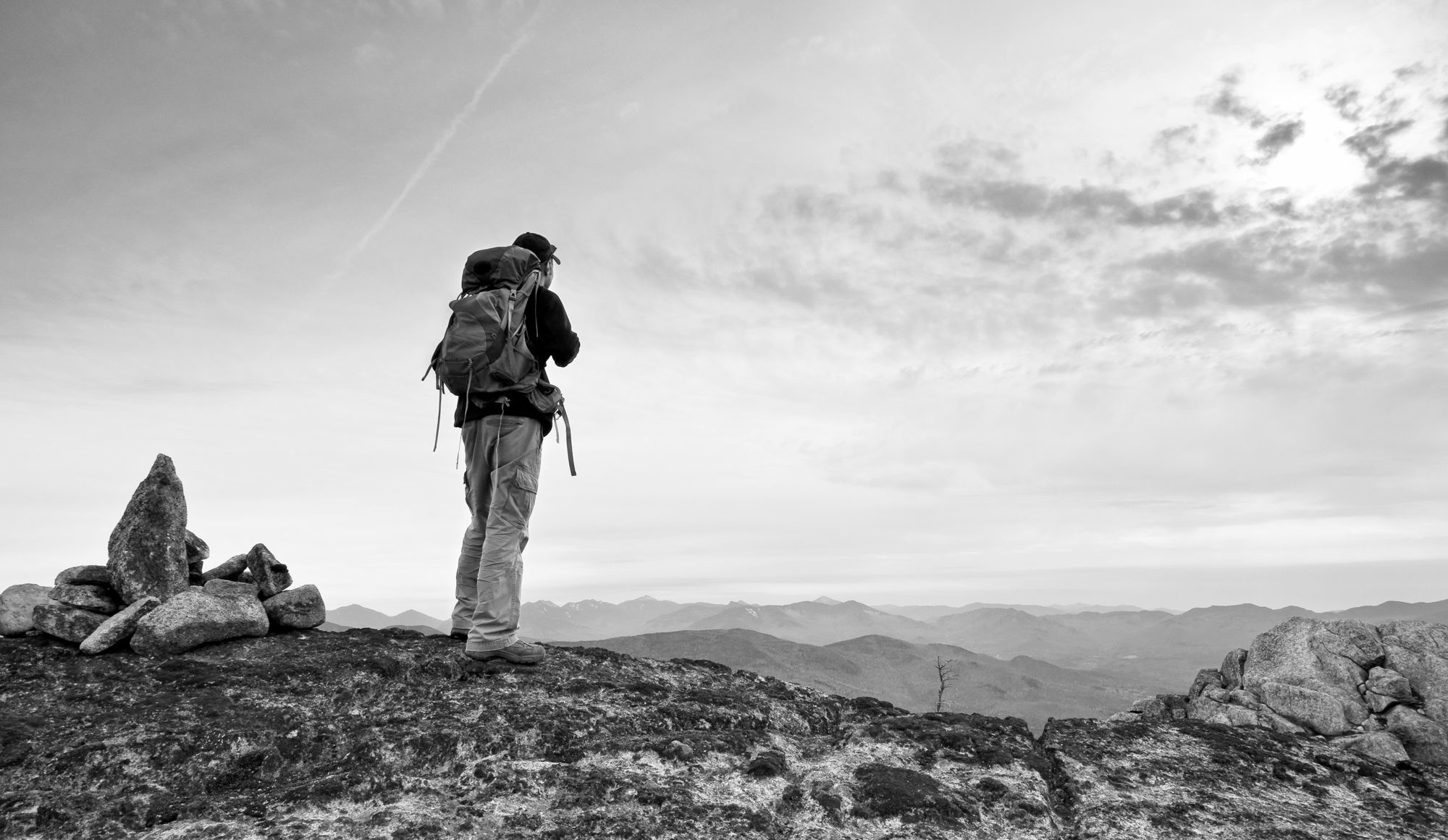 A hiker on a rocky ridge